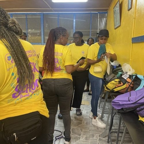 The Love of Hearts Foundation team organizing packages at the Back-to-School drive 2025 in Westmoreland Jamaica.